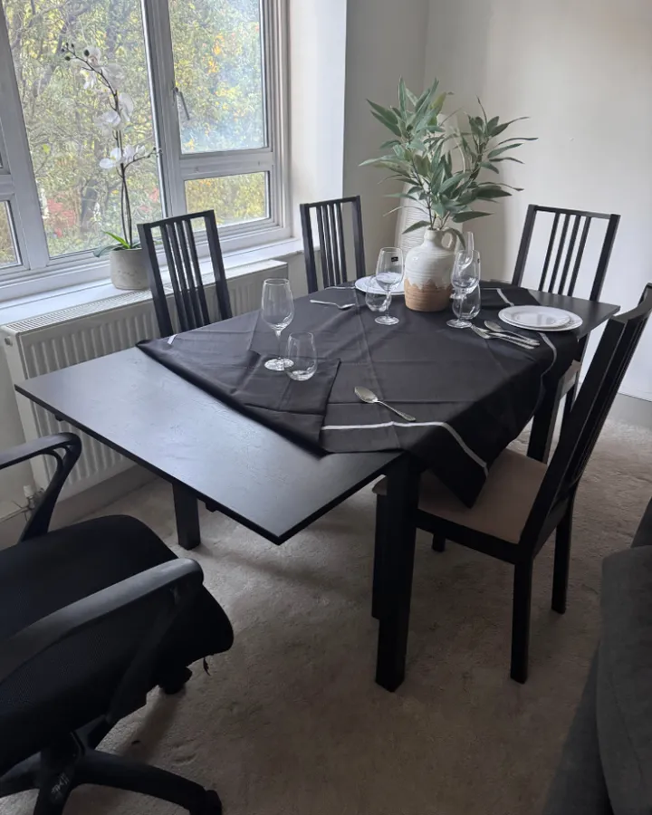 Dining table left with dishes and clutter