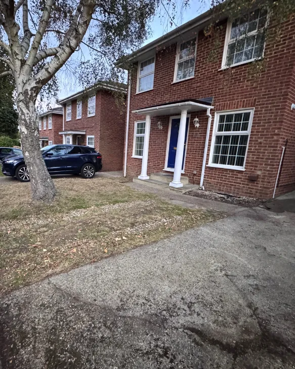 The same front lawn mown short