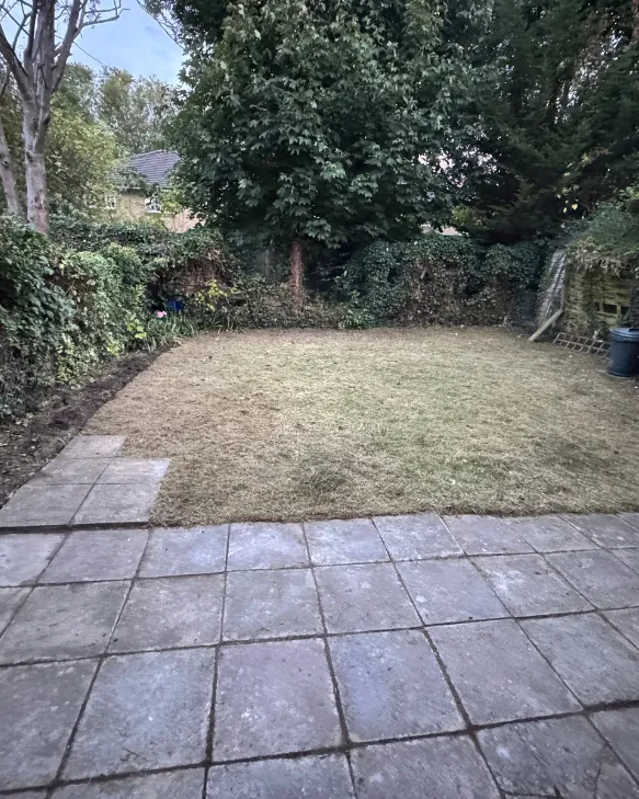 The same garden with the lawn cut short and the patio cleared