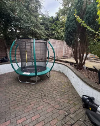 The same patio swept clear of leaves