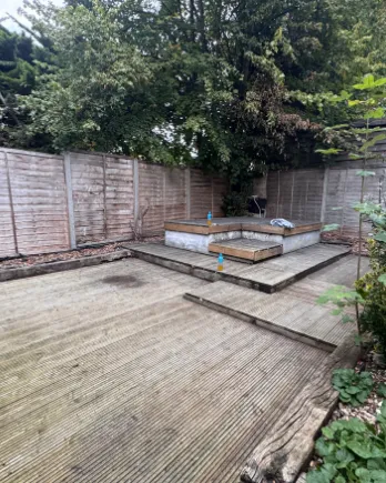 Garden decking and raised bed cleared and swept