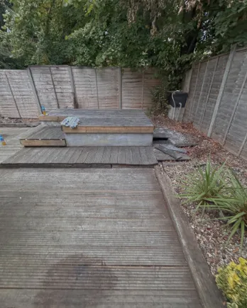 Cleared garden decking with the leaves and moss gone